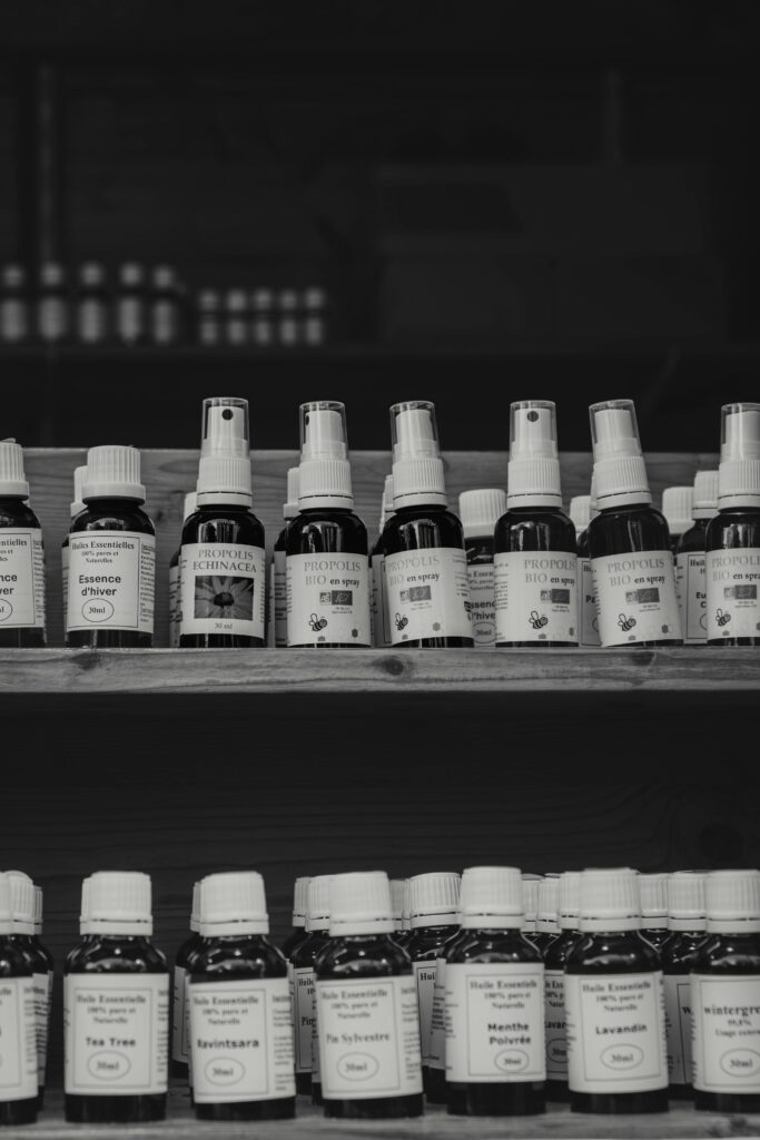 pexels photo 29565034 29565034 A black and white image of natural health products on wooden shelves at a market.